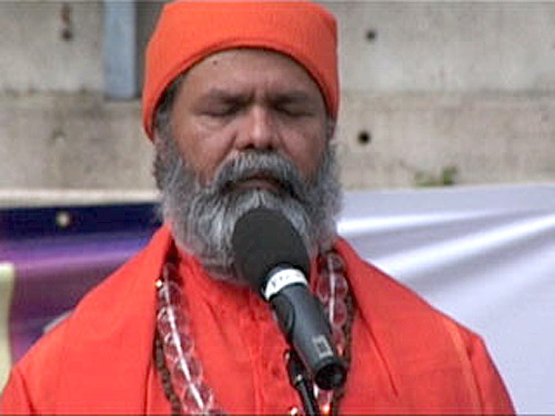 Swamiji in silent prayer on the Holi festival at Darling Harbour