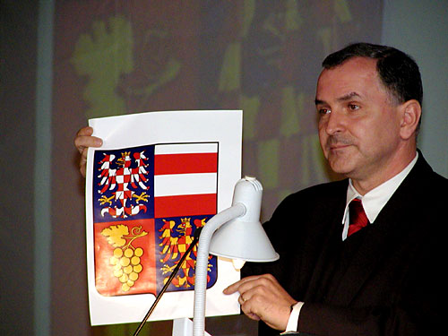 Ing. Stanislav Juranek, Governor of South Moravia, showing Moravian coat-of-arms and explaning its symbols of peace and mutual coexistance