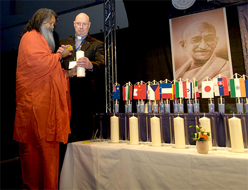 His Holiness Vishwaguru Paramhans Swami Maheshwaranandaji and Monsignor David Cappo are kindling a candle during the opening act of the World Peace Summit 2007